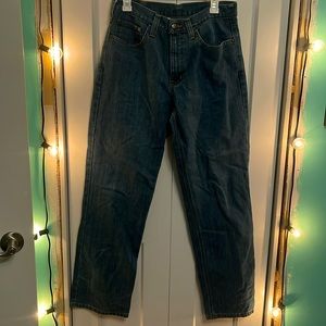 Relaxed fit Carhartt medium to dark wash denim jeans